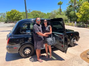 Couple standing in front of the car