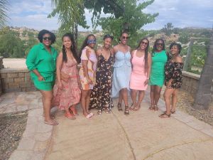 people standing together in a winery